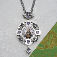 2.7.2715лр-18/154лр Панагия латунная с фиолетовыми камнями в серебрении